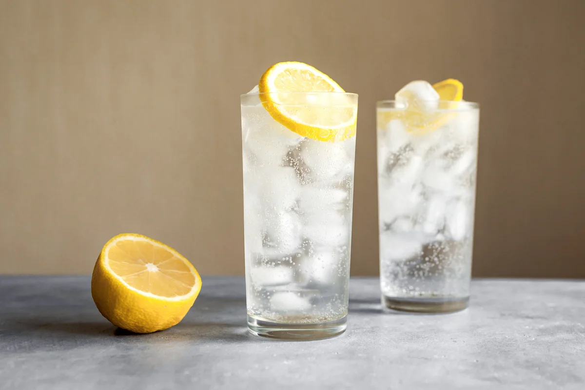 Cocktail with lemon in classic glasses
