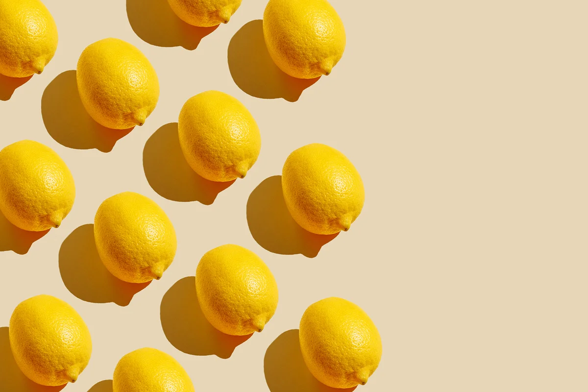 Pattern of citrus-fruit of Lemons on beige background.