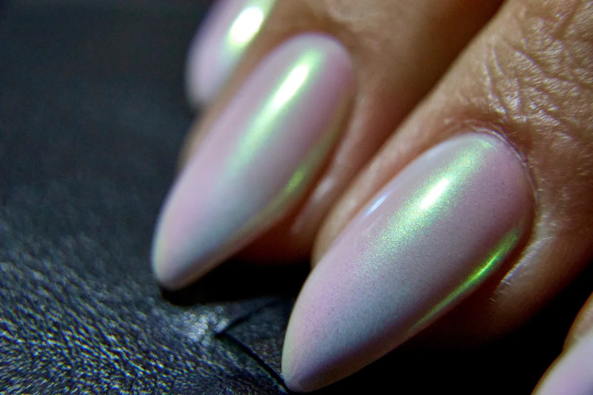 close-up of nails with a manicure with mother-of-pearl varnish