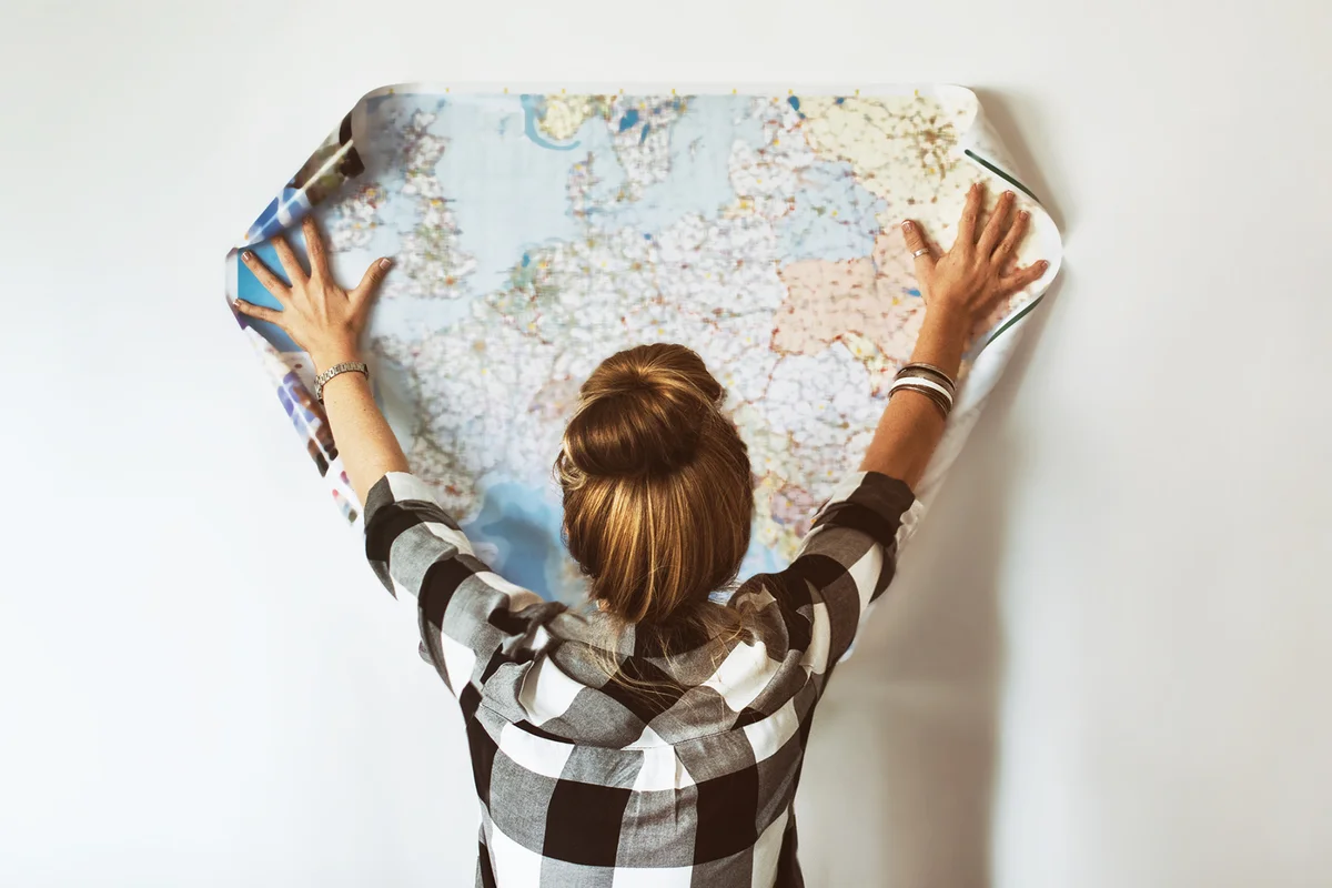 Young woman looking at map