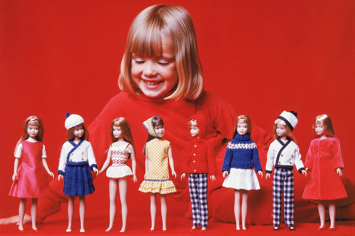 Girl Plays With Skipper Dolls