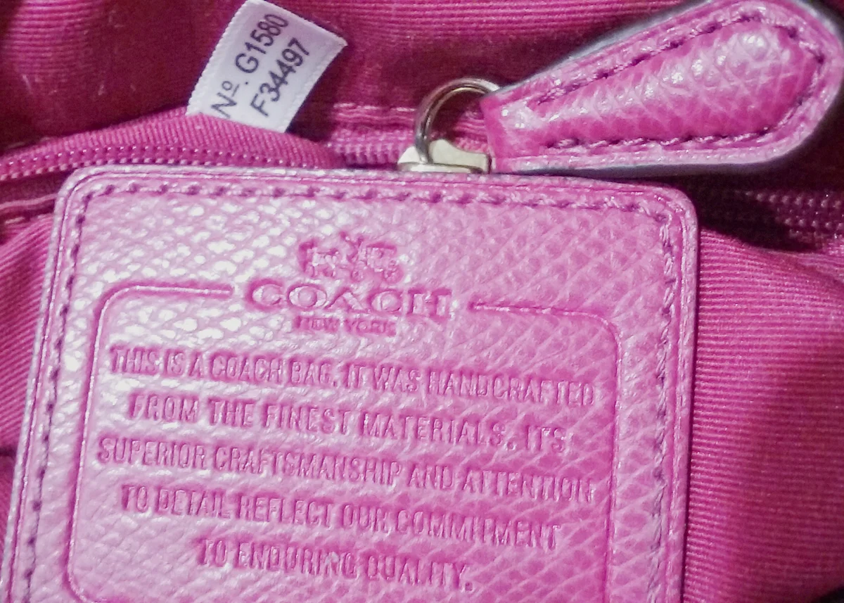 Coach bag creed and tag closeup