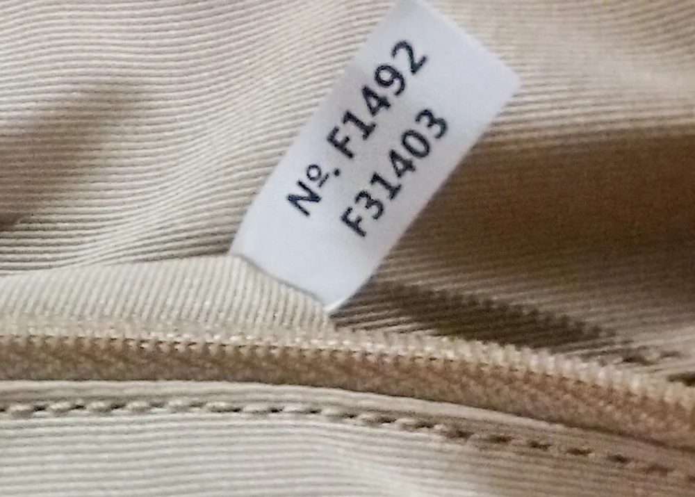 Coach bag serial number tag