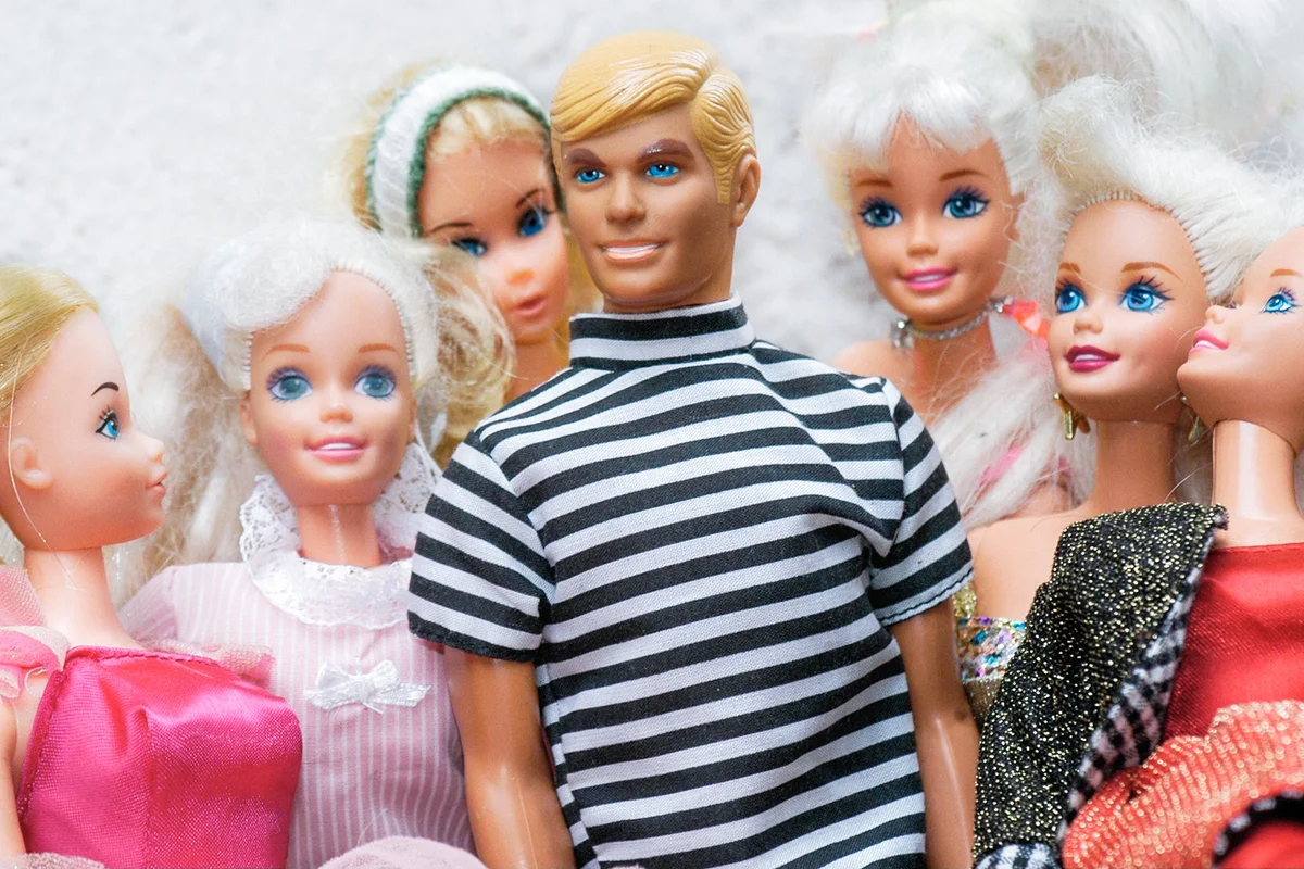 Barbie dolls, in the middle Ken