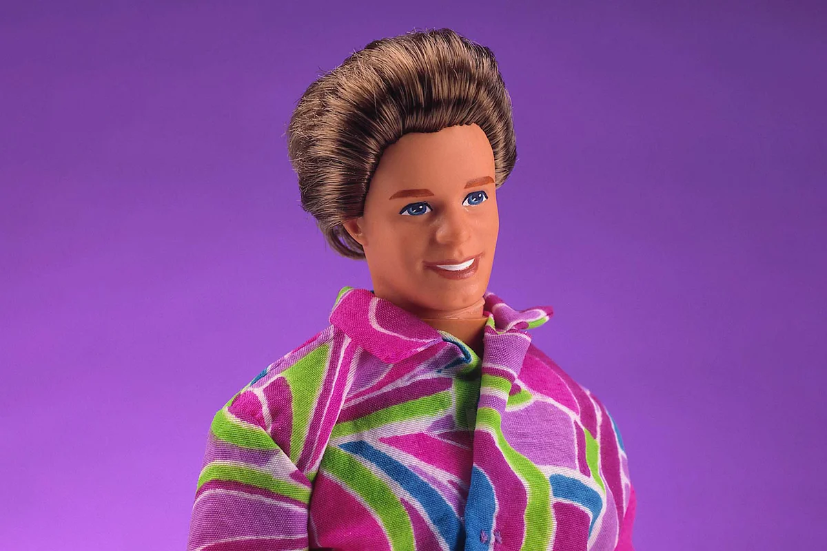 A 1992 Total Hair Ken doll wears a multi-colored patterned shir