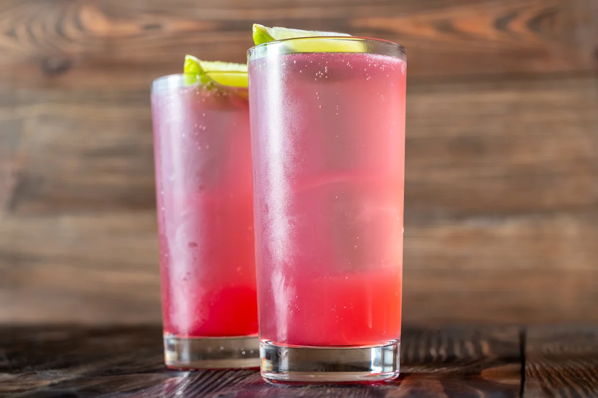 Two El Diablo Cocktails garnished with lime wedges
