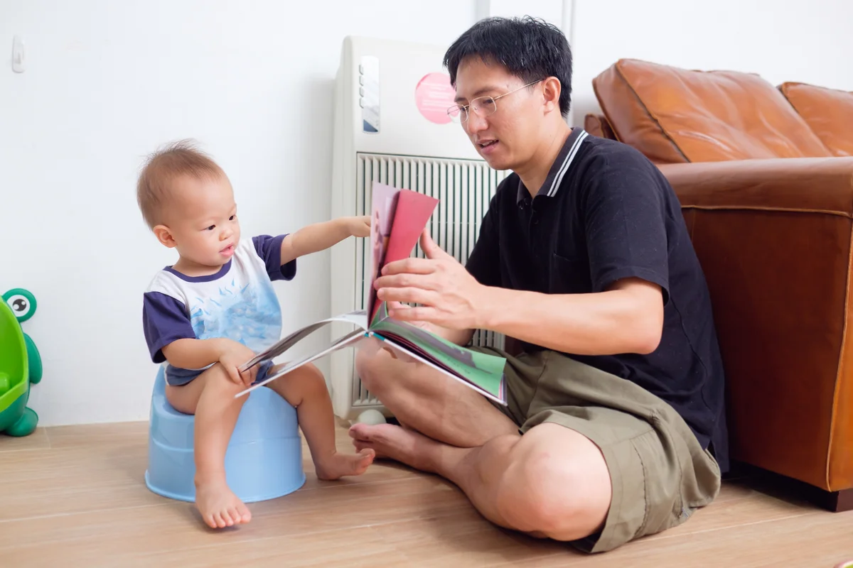 father reading potty books