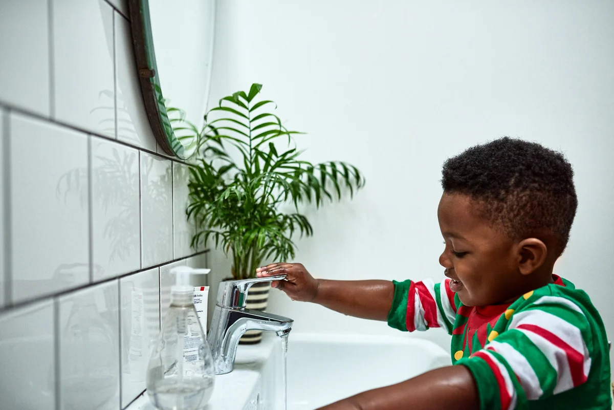 toddler washing hands