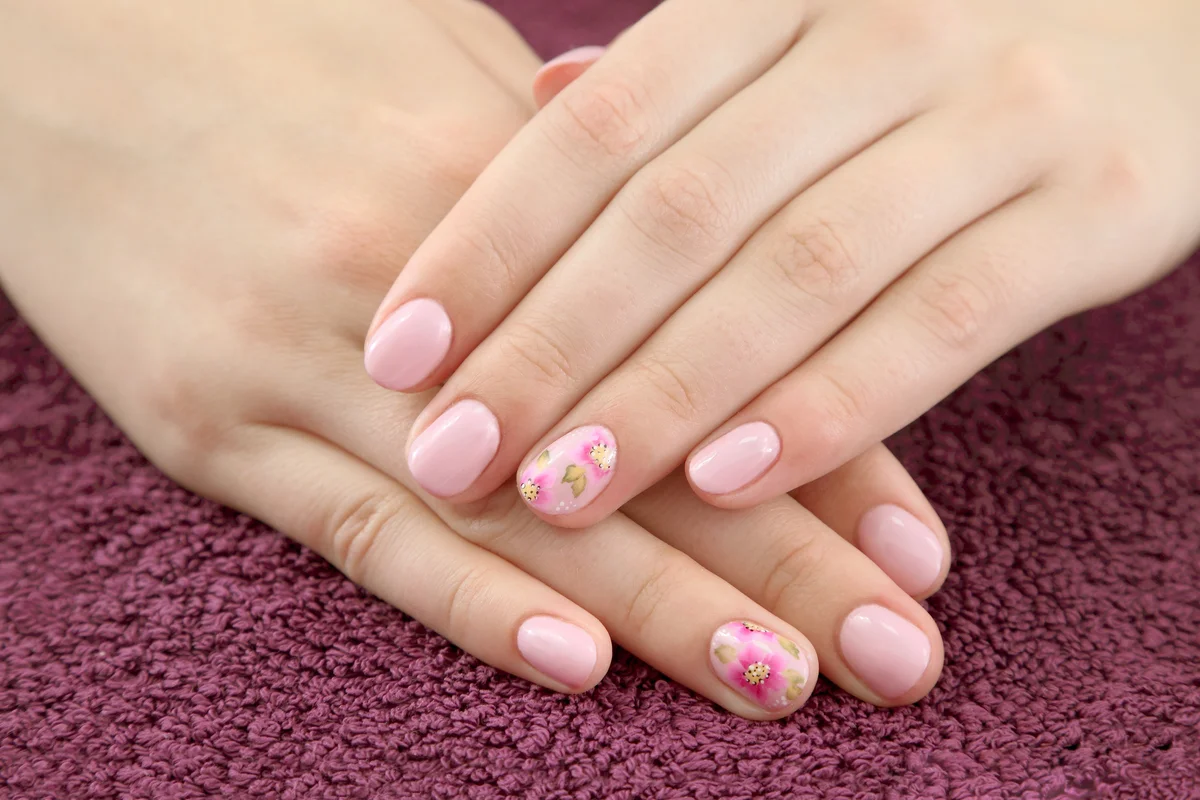 Woman with pink florals nails