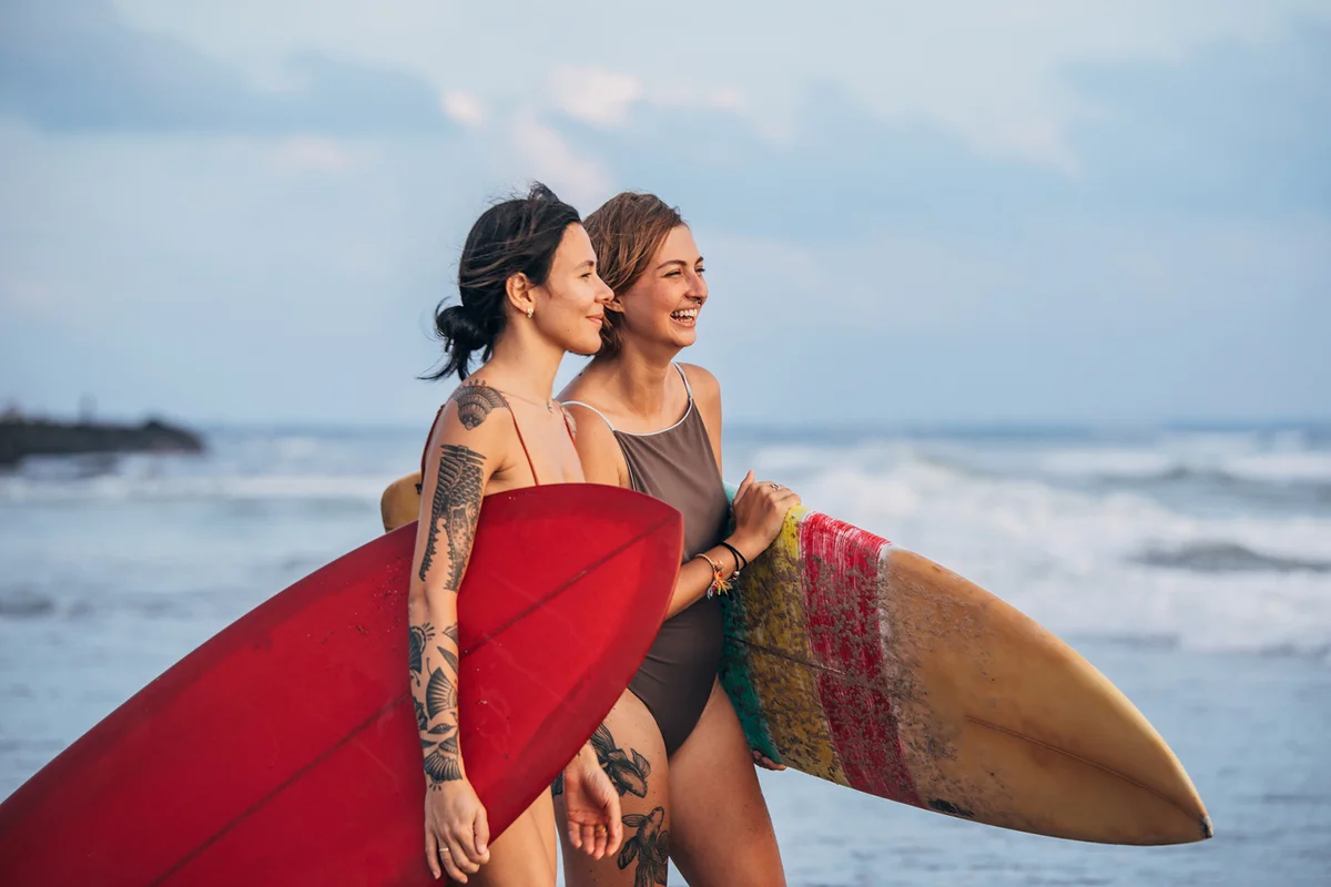 Woman surfers at the beach