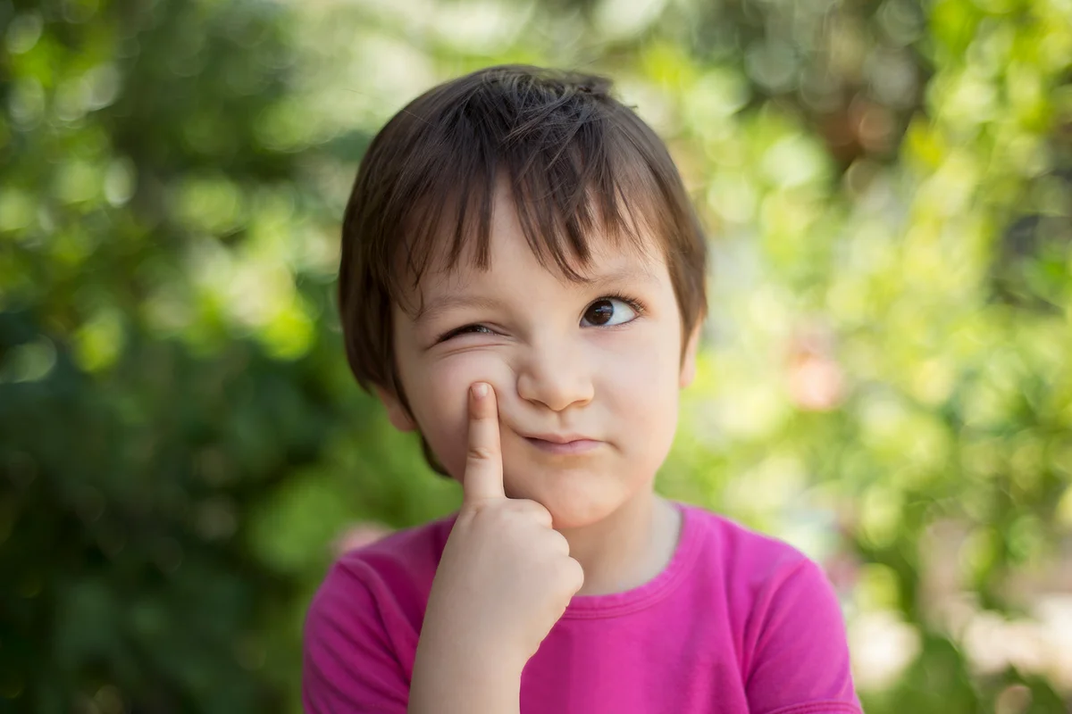 thinking child looking away with thoughtful facial expression