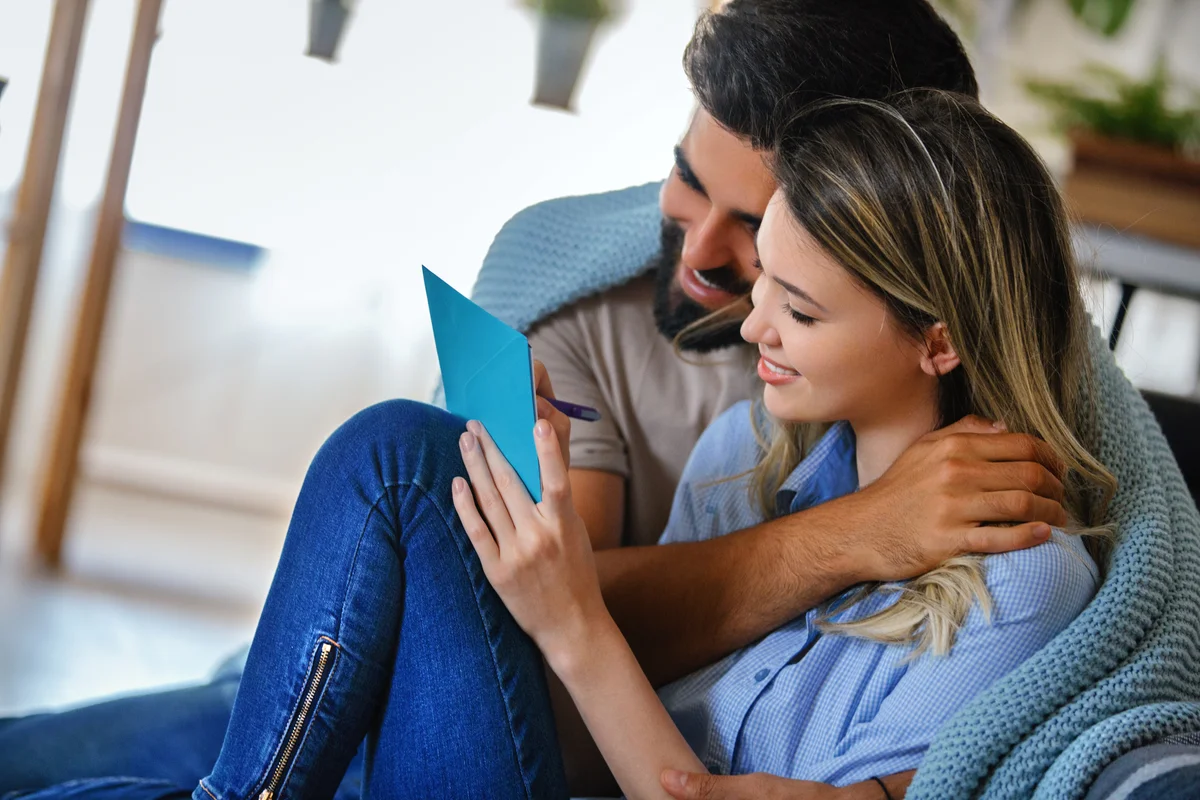 Couple writing a card