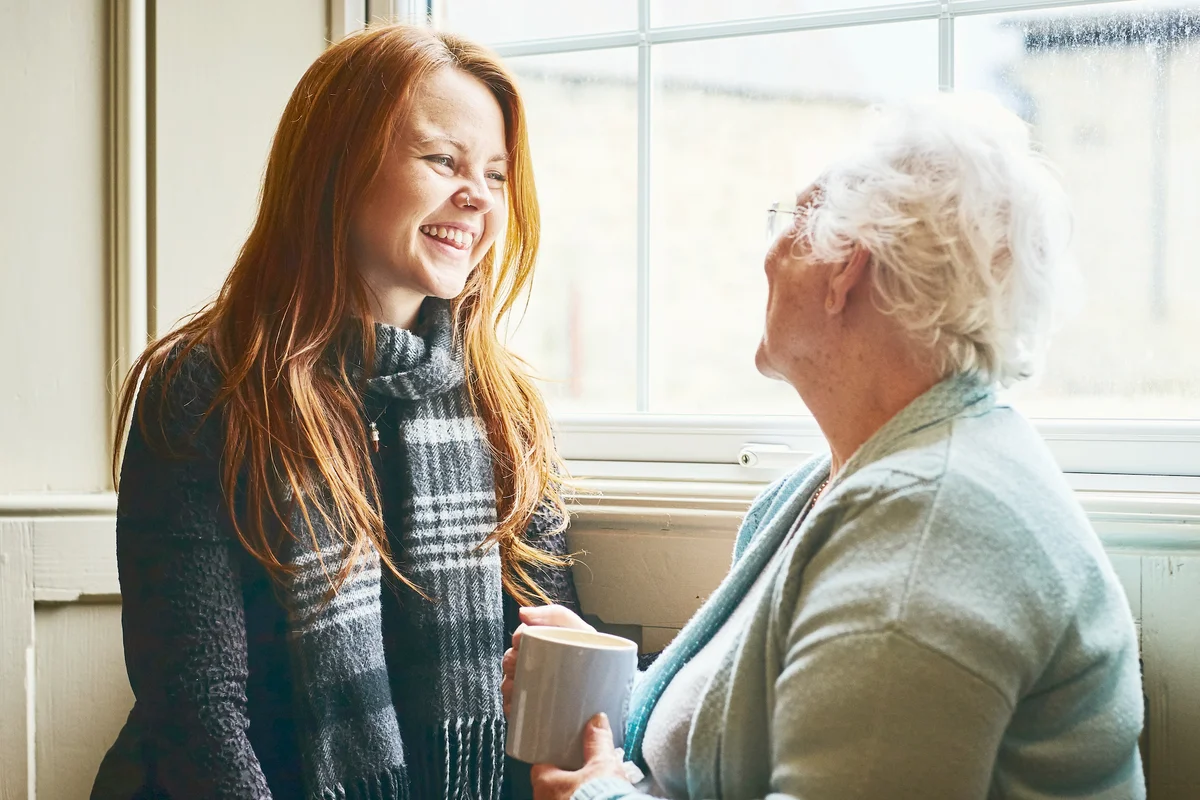 Young woman talking with her grandmother