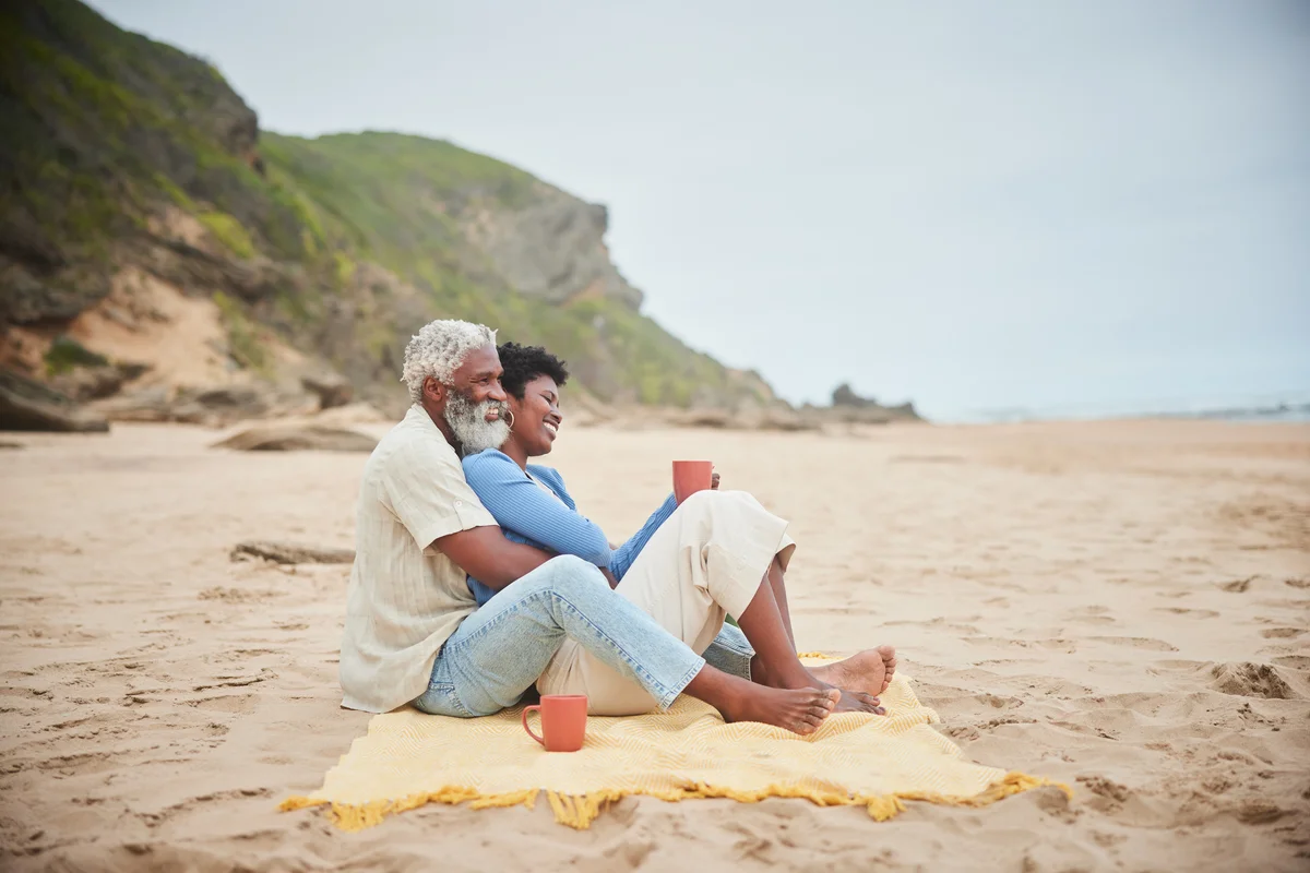 couple having coffee on the beach