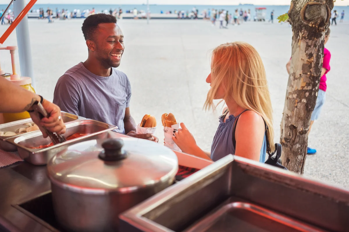 couple at a beach food truck