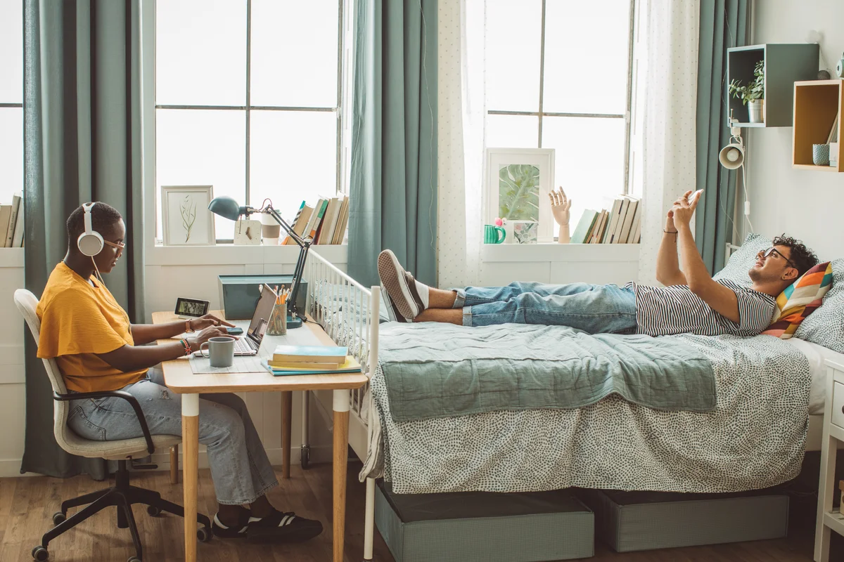 two students in a dorm room