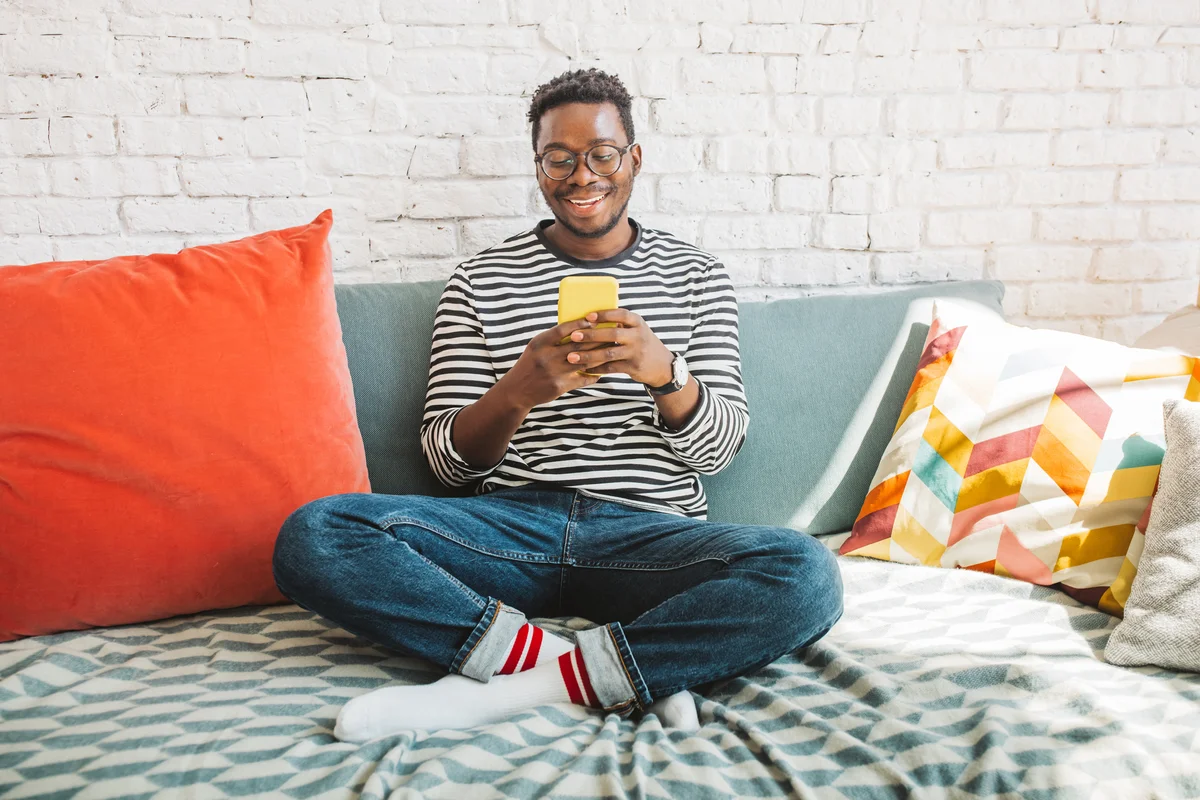 young man on comfy pillows