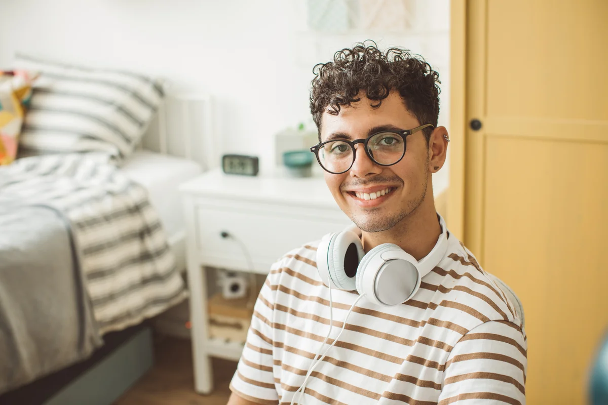 man in dorm room