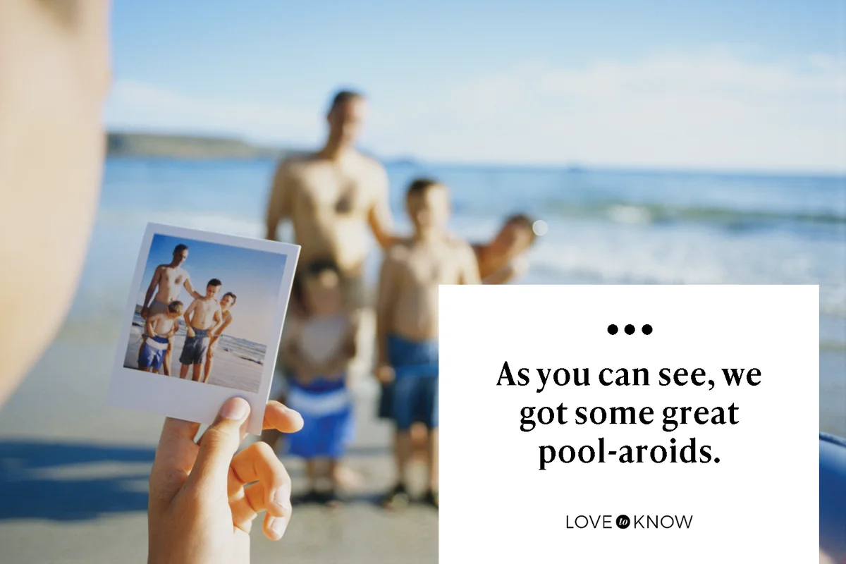 Boy holding a polaroid photo of his family on the beach