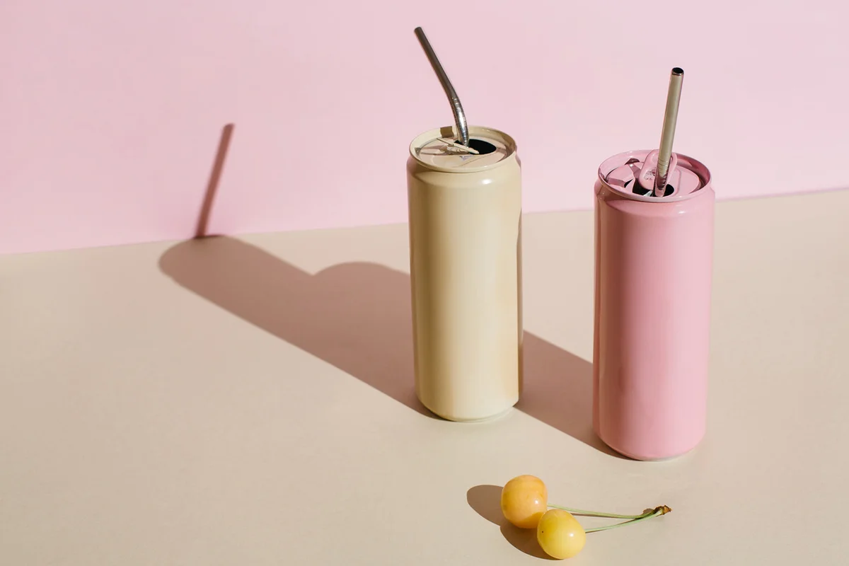 Pink and beige aluminum drink can