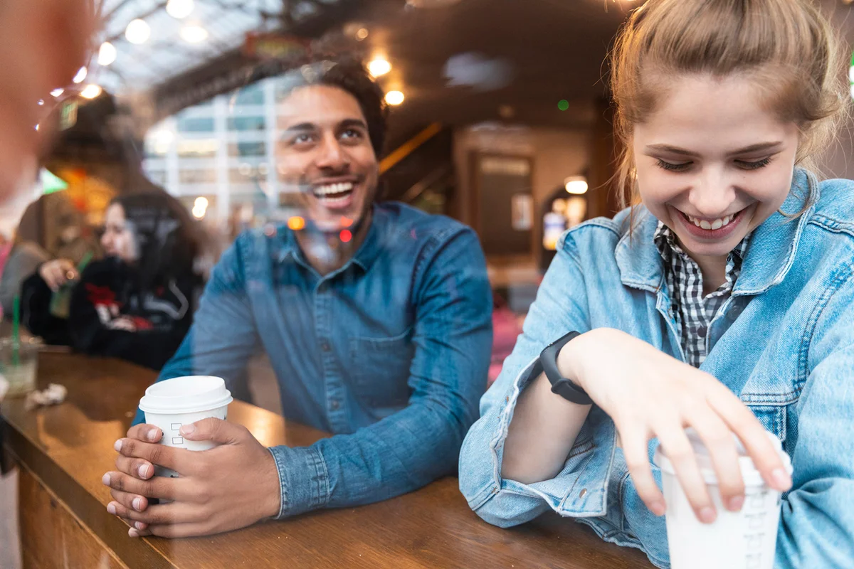 Friends having fun together in a coffee shop