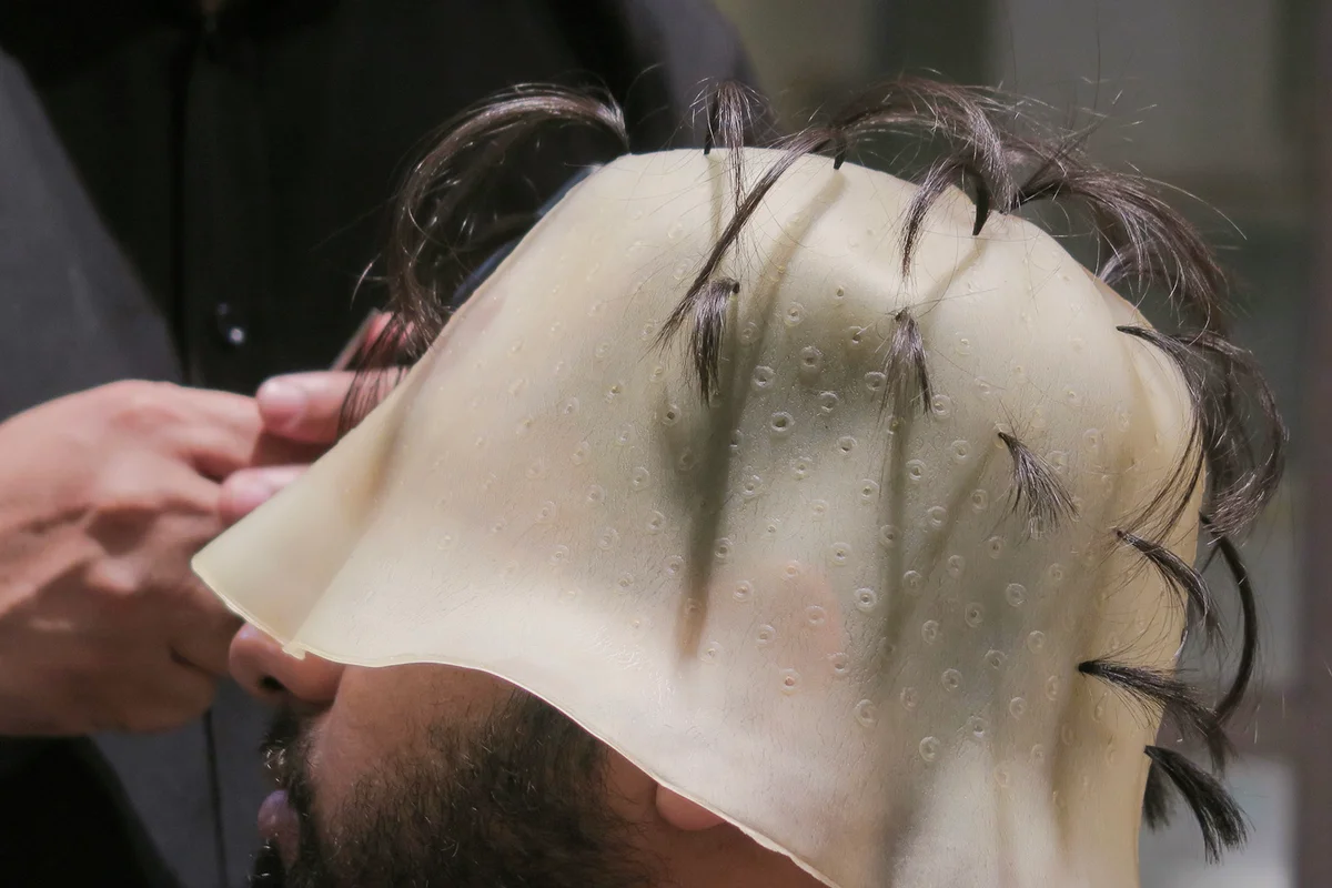 wearing hair highlighting cap