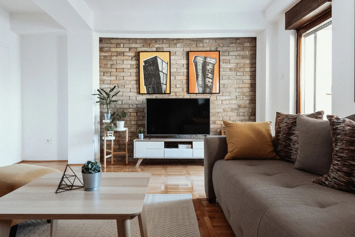 living room with sofa and paintings on the walls