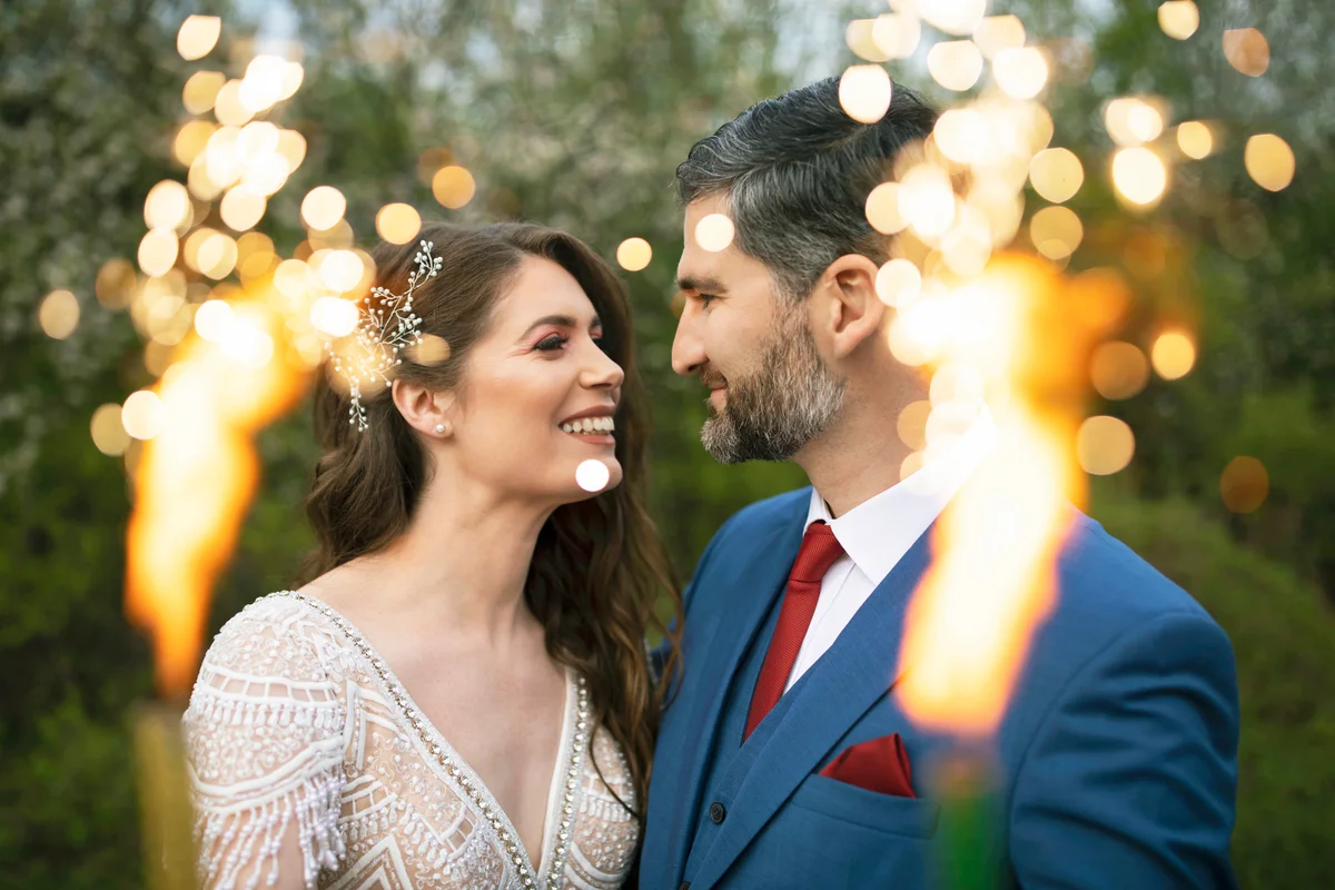 Bride and groom holding sparklers
