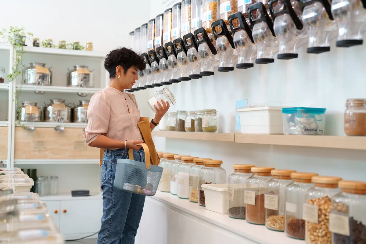 woman reading a label in a bulk items store