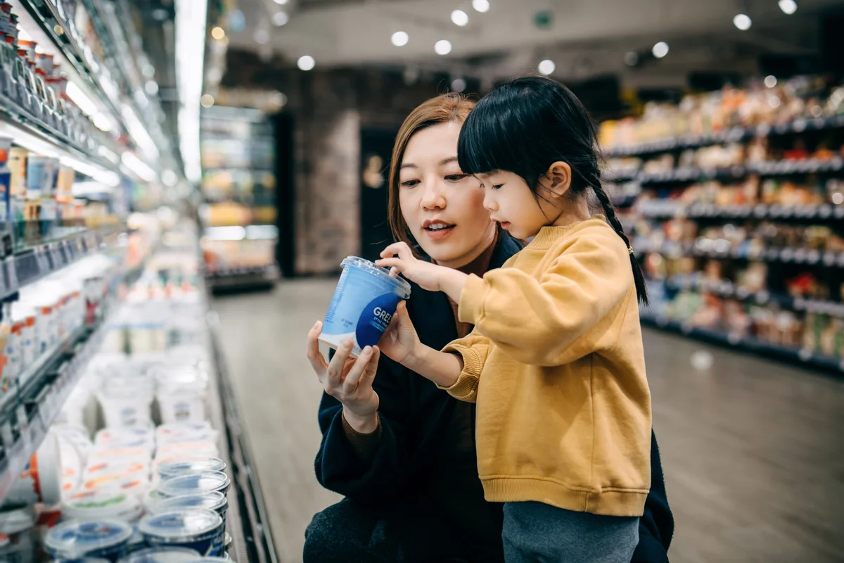 mom and daughter in the grocery store