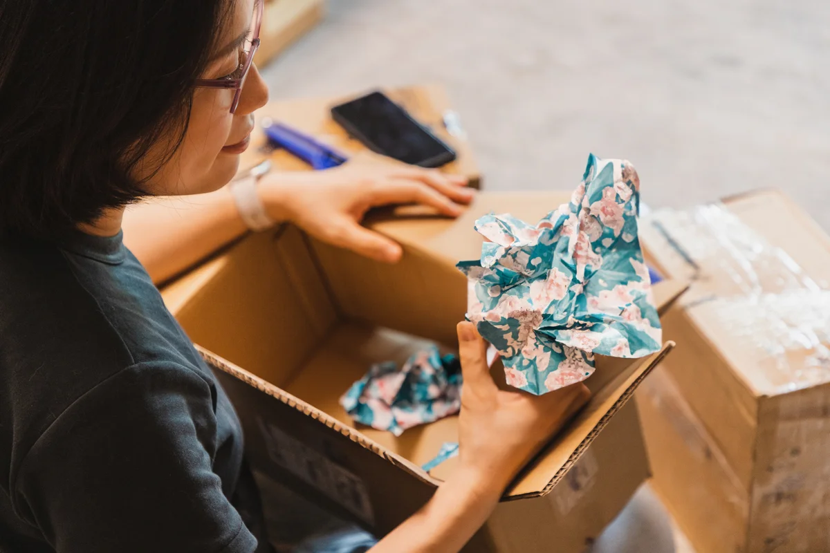woman packing in a box