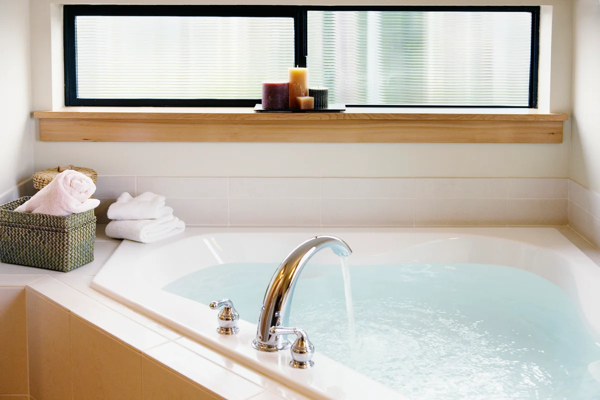 filling up the tub with water