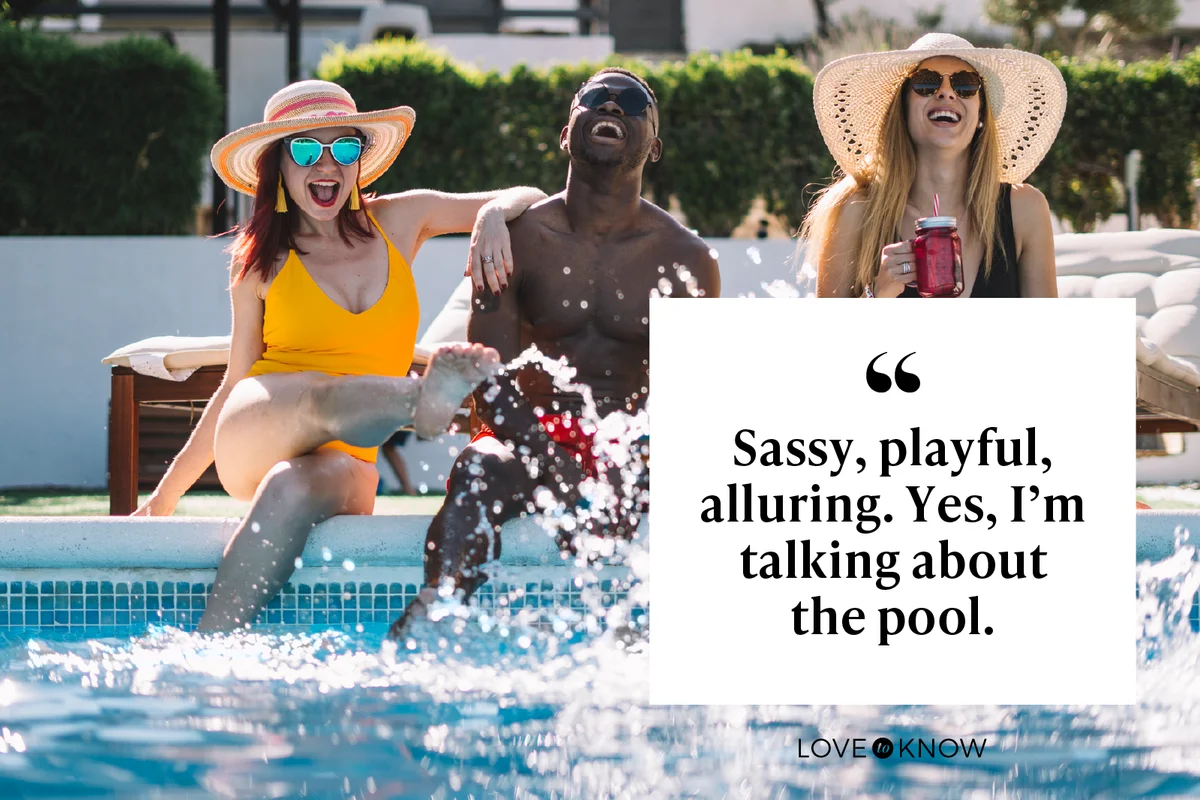 Two happy women and a man sitting at the pool splashing with water