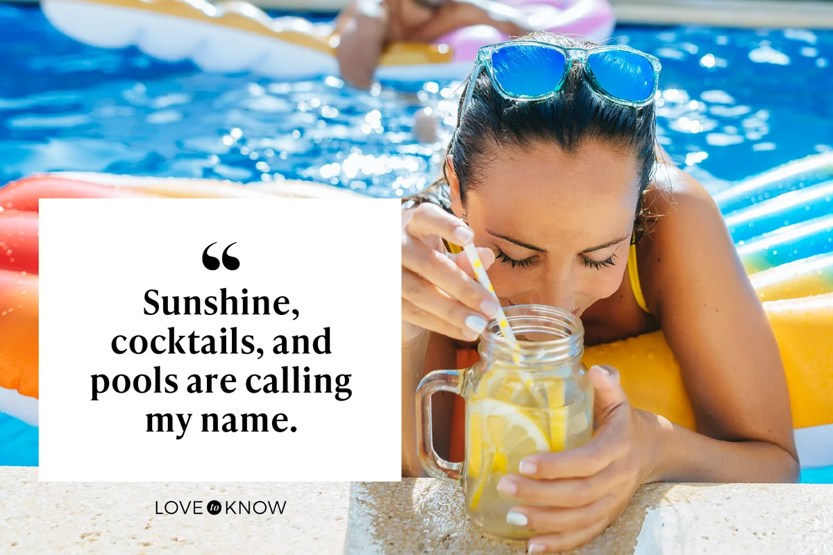 Woman drinking cocktail by the pool