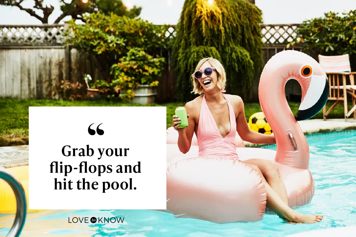 Laughing woman sitting on inflatable pool toy