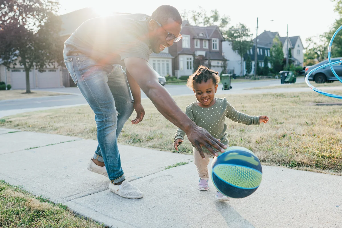 Toddler playing with ball