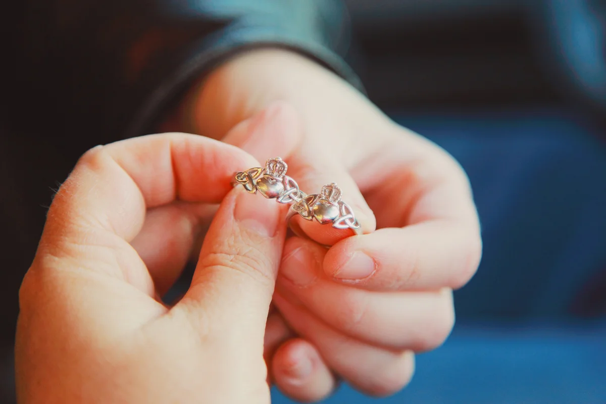 Two women holding crings