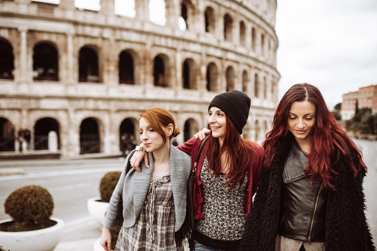 Tourists in rome take walking under the coliseum