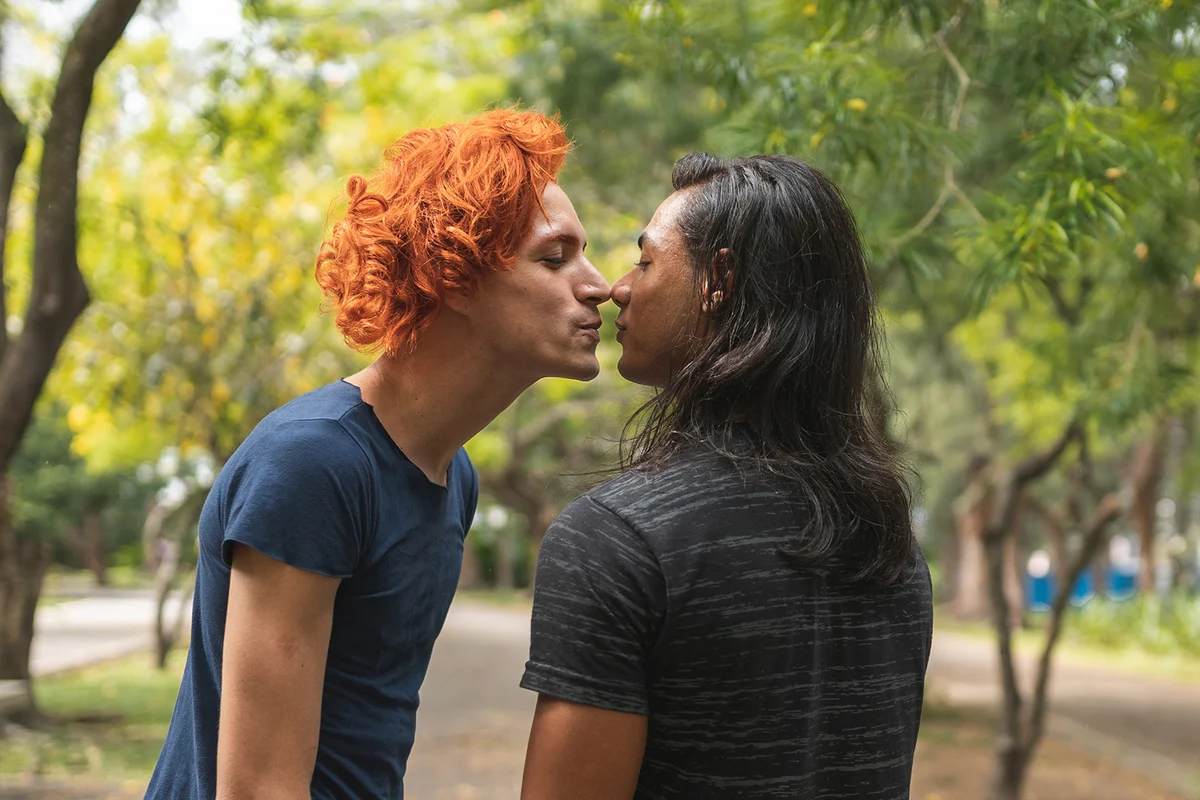 Couple kissing outdoors