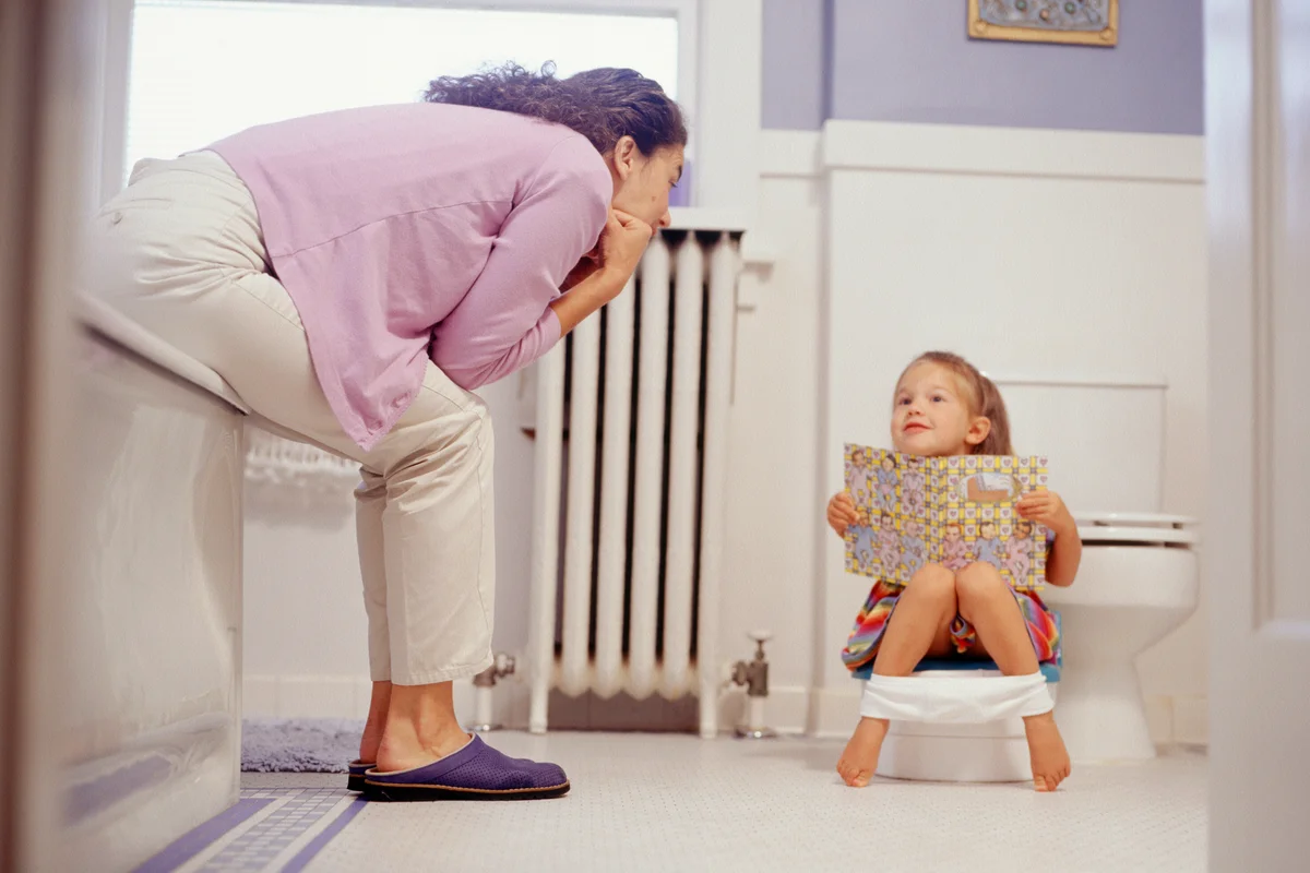 Mother potty training daughter