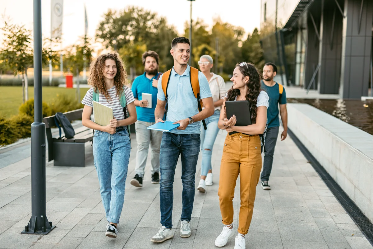 Group of friends walking on the university campus
