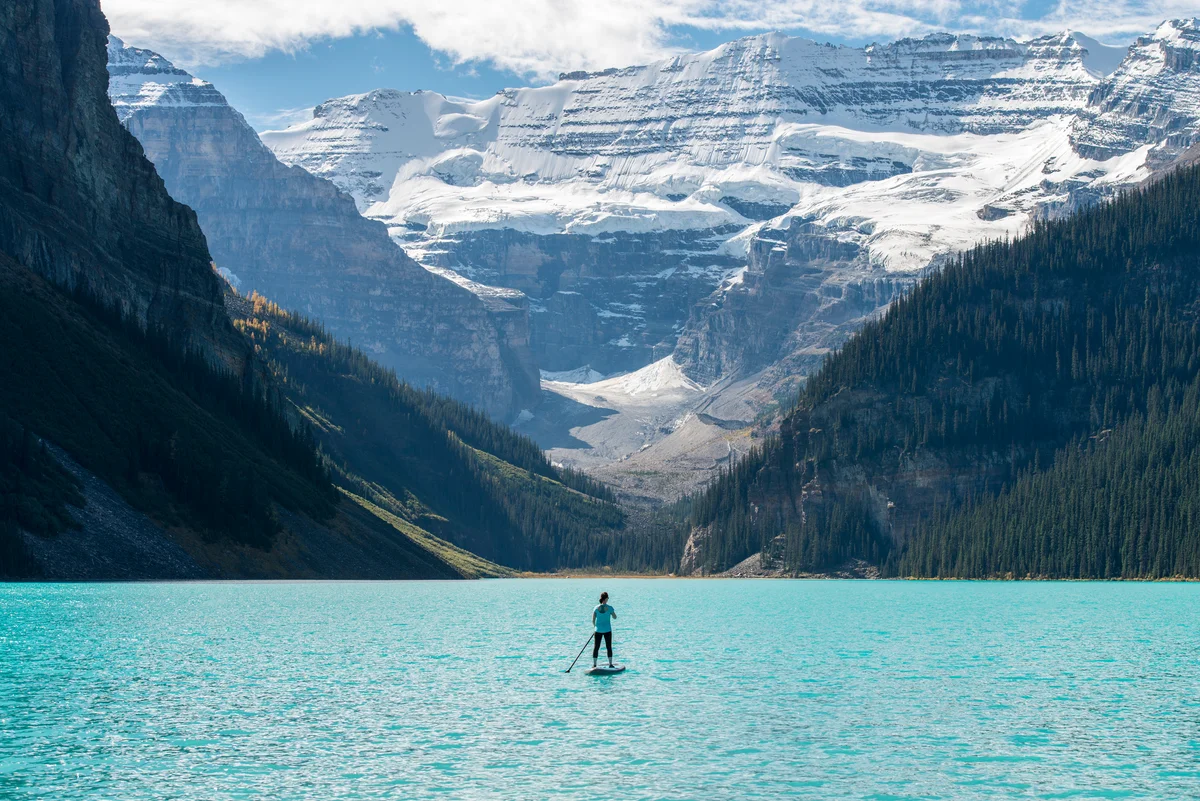 woman on paddle board at Lake Louise