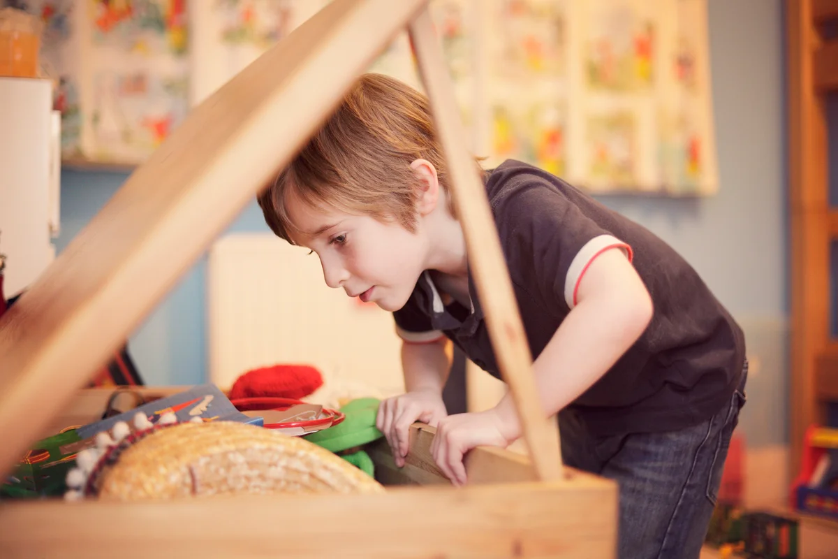 boy and toy chest