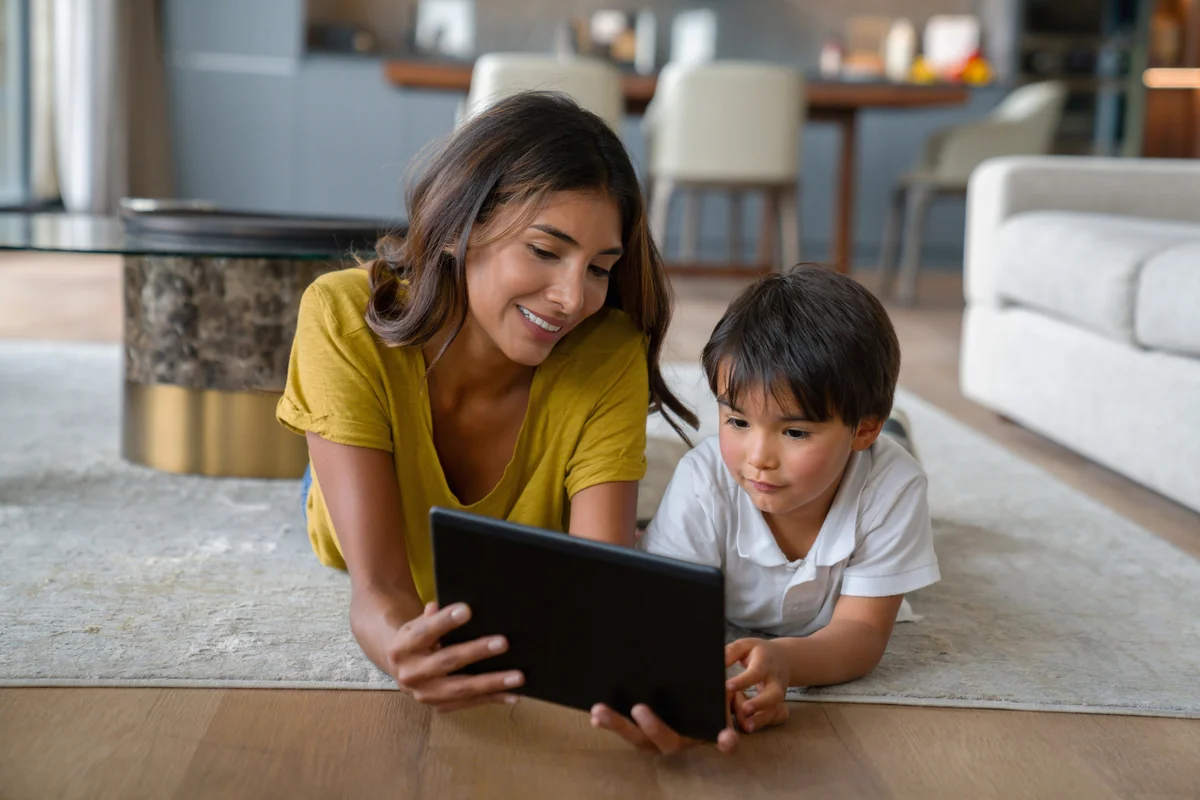 mom and son on tablet