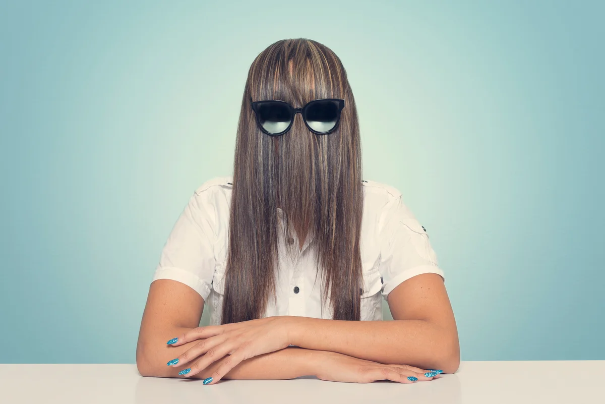 woman hiding behind hair