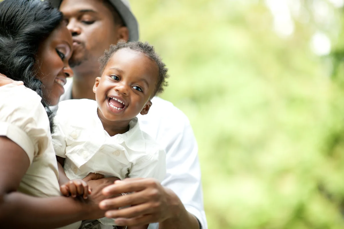 adorable toddler with parents