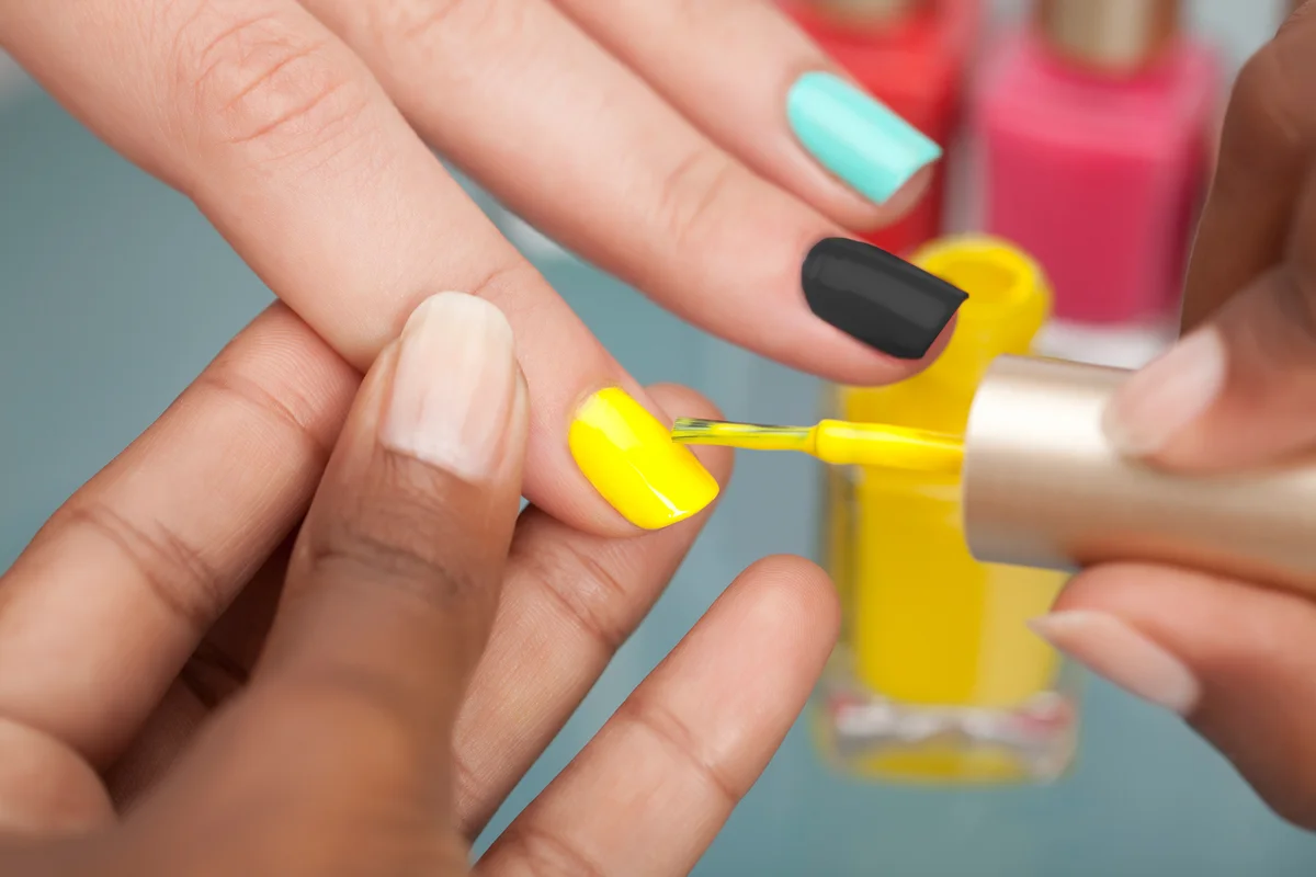 Woman getting manicure