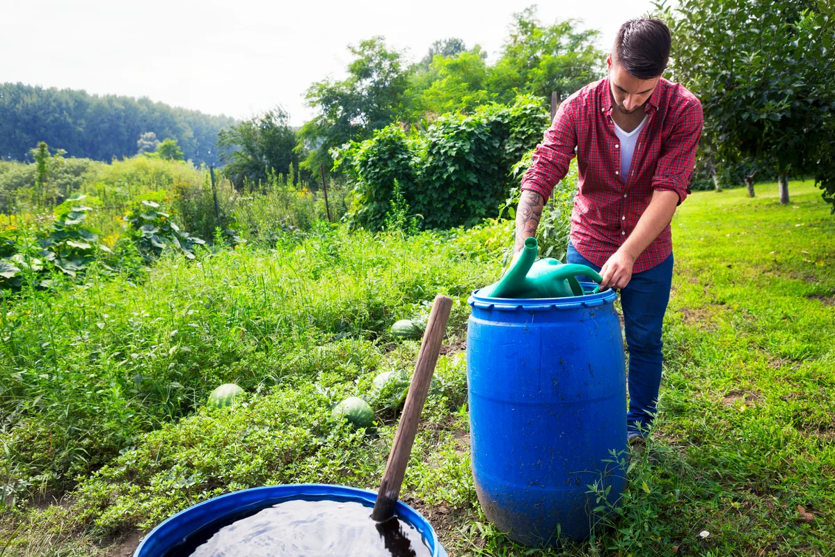 man collecting rainwater