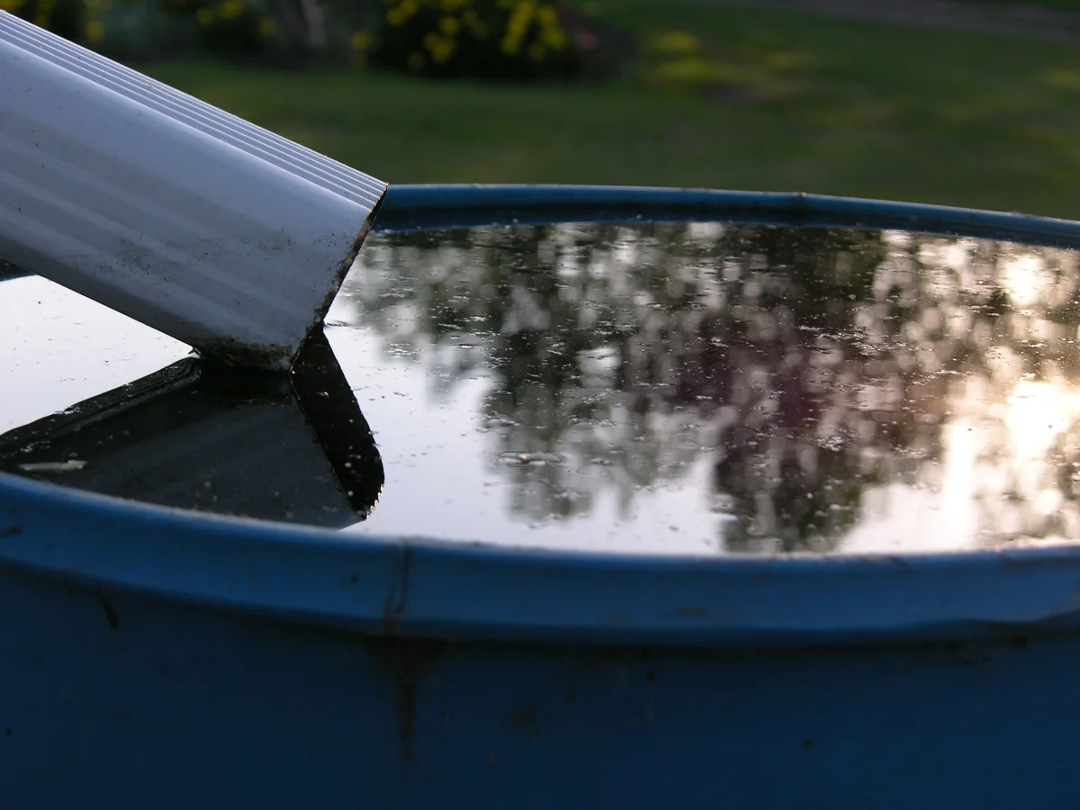 downspout into a rain barrel