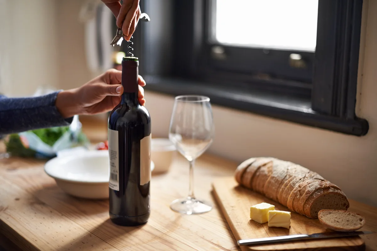 opening a wine bottle